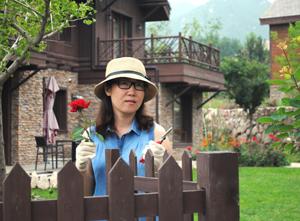 Anne Lui outside her home