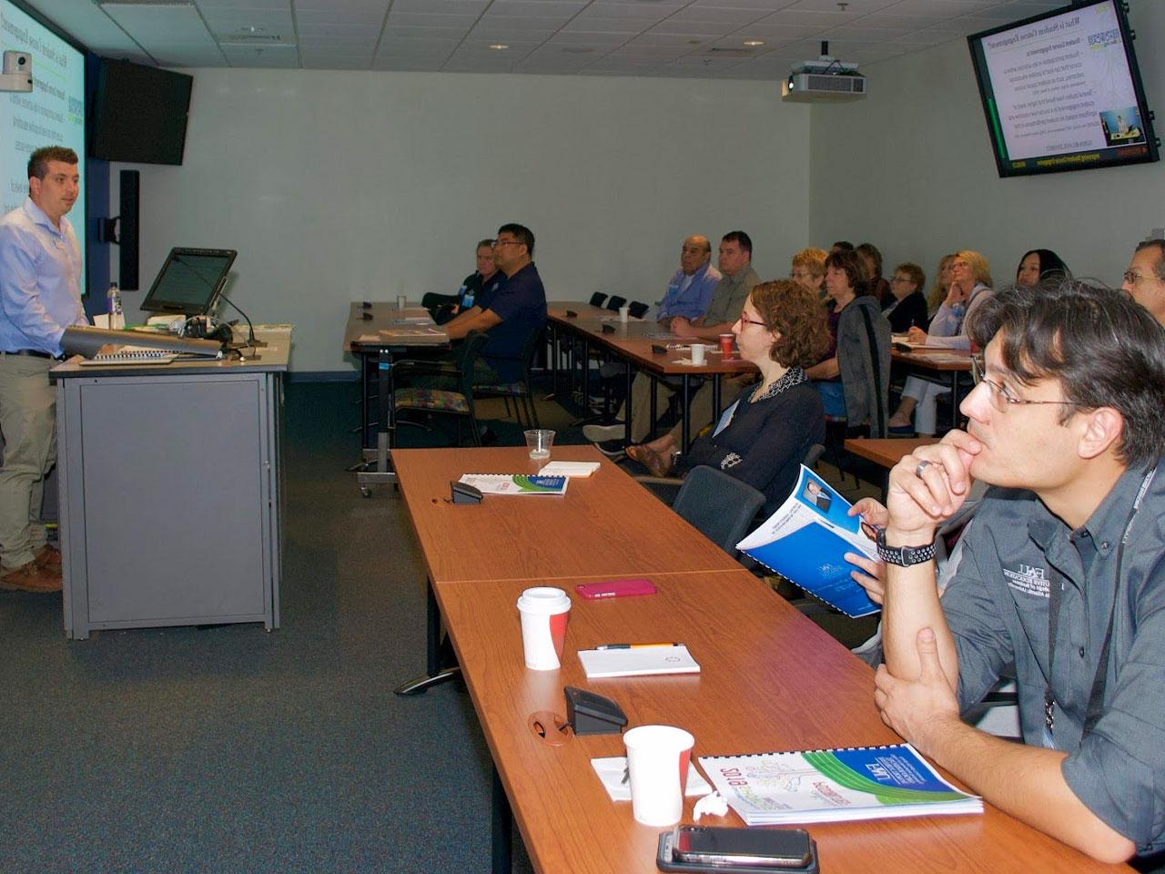 one faculty sitting next to an instructional designer